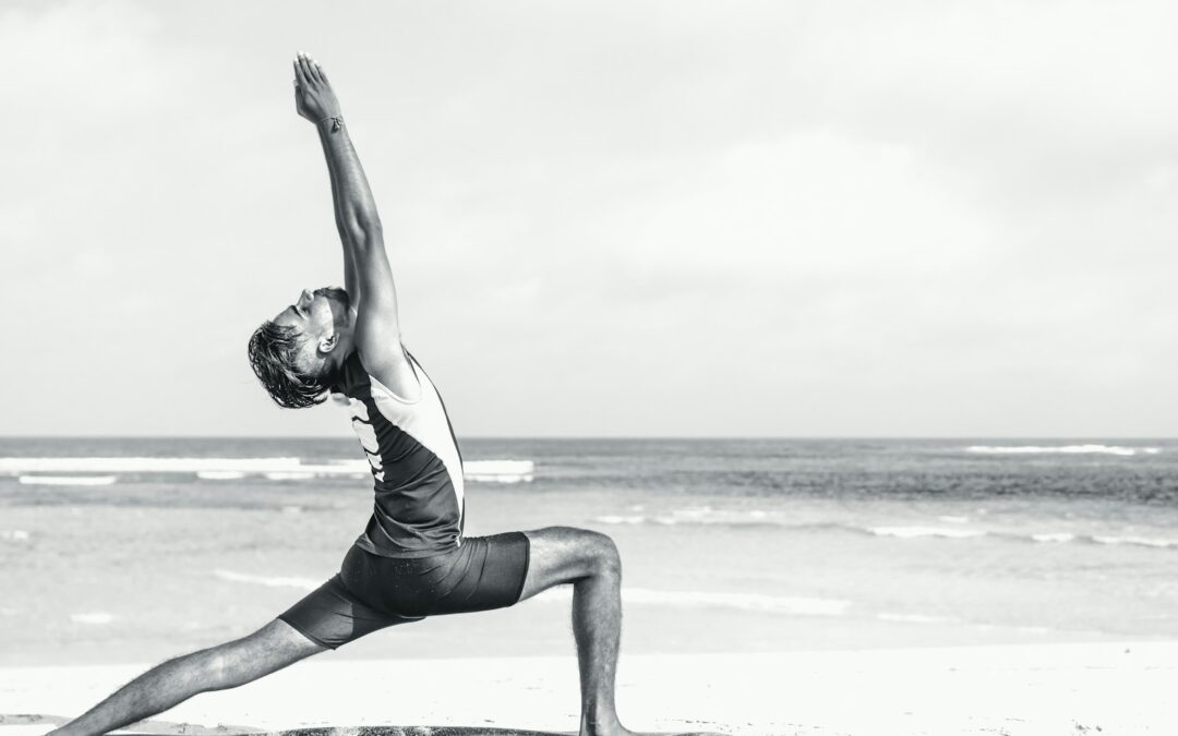 man stretching on seashore