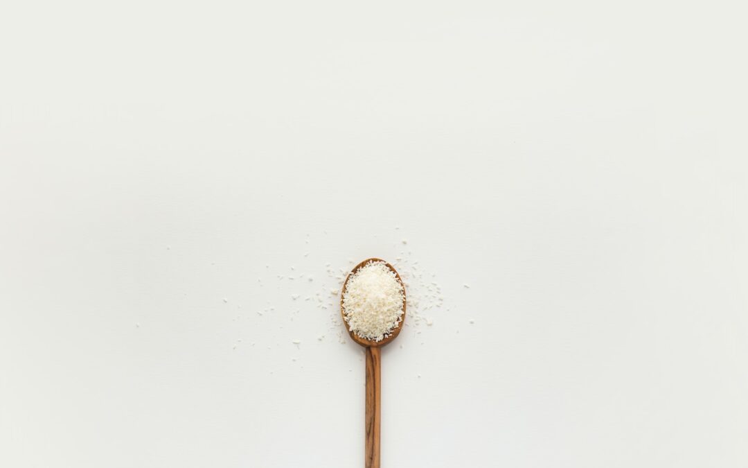 white powder on brown wooden spoon