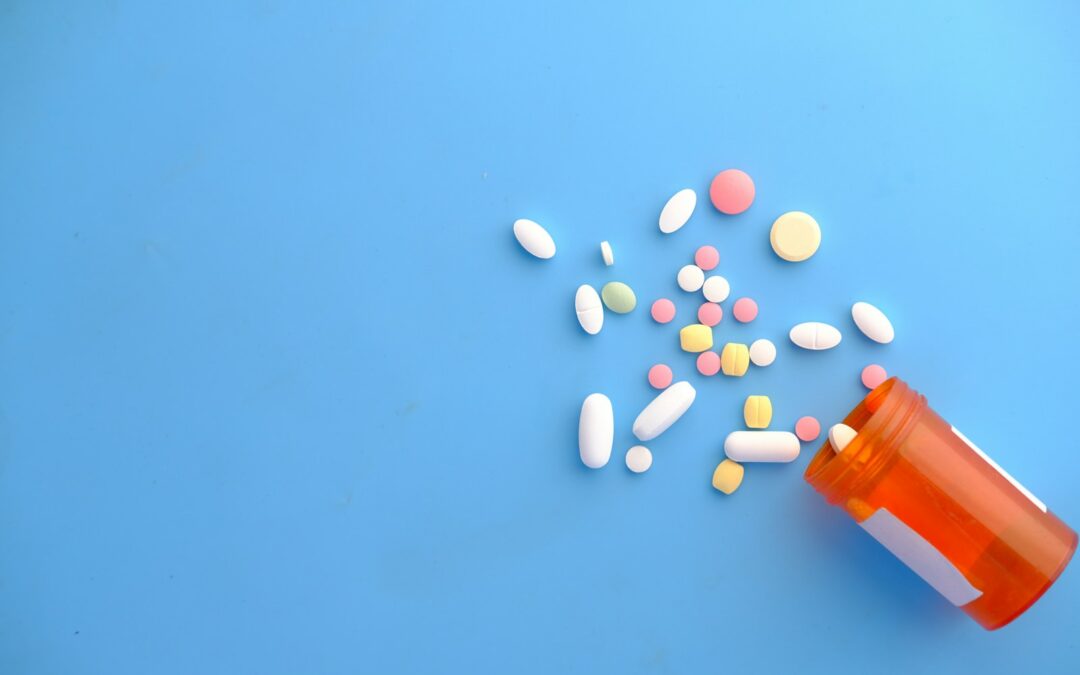 orange and white medication pill