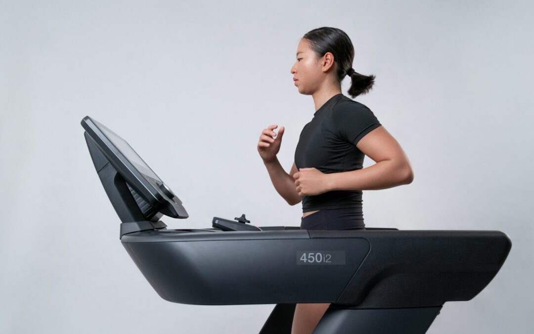 a woman is running on a treadmill